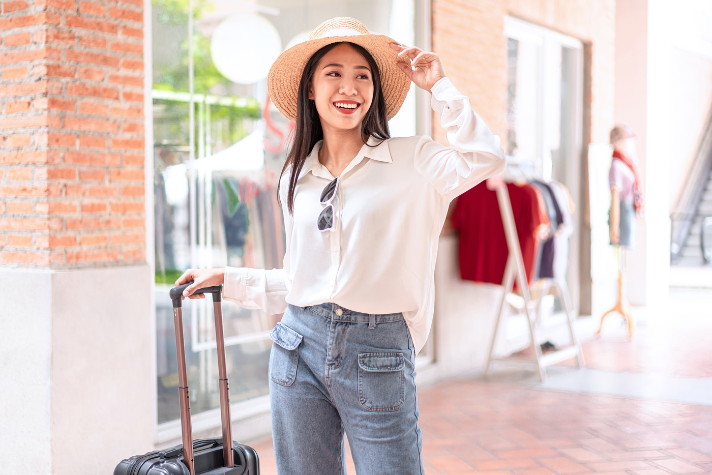 Smiling Woman Traveler Dragging Black Suitcase 